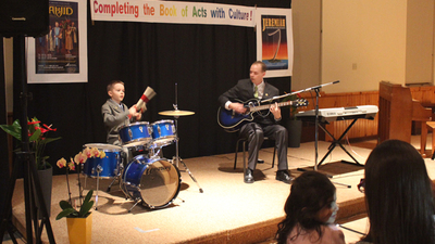 Father and son, James and Seven Fuller perform an original piece for guitar and drums. (Photo: Raj Ebenezar)