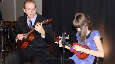 PCG member James Fuller and his daughter Shira perform an original ukulele duet called “Purple Polka Dots.”