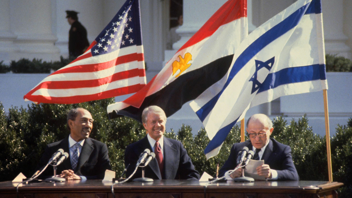 16x9(Peace Momentarily)
WASHINGTON DC - MARCH 26: This handout file photo provided by the Israeli Government Press Office (GPO) on March 25, 2009, shows Israeli Prime Minister Menahem Begin (R) addressing the peace treaty signing ceremony as Egyptian President Anwar Sadat (L) and U.S. President Jimmy Carter watch on the White House lawn on March 26, 1979 in Washington, DC. Israel and Egypt will mark 30 years since their then leaders signed the historic agreement, making Egypt the first Arab nation to recognize the Jewish State.  (Photo by Ya'akov Sa'ar/GPO via Getty Images) *** Local Caption *** Menahem Begin;Anwar Sadat;Jimmy Carter