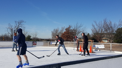 Philadelphia Church of God members play hockey in Edmond during the ministerial conference