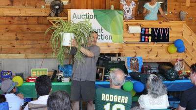 Regional Director Fred Dattolo takes bids during the live auction.