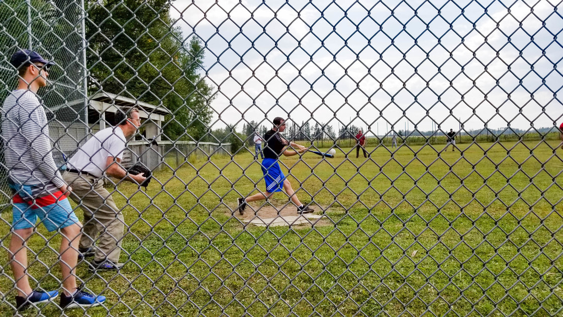 ACT CAN softball game, Joel Price taking a swing