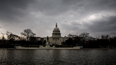 US Capitol Building under dark, gloomy skies. US Capitol Building in Washington D.C.
