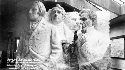 A model at the site depicting Mount Rushmore's intended final design.